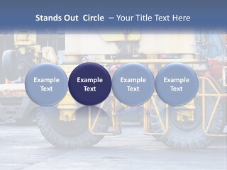 A Large Yellow Machine Is Parked In Front Of A Building PowerPoint Template