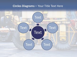 A Large Yellow Machine Is Parked In Front Of A Building PowerPoint Template