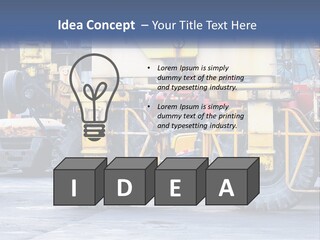 A Large Yellow Machine Is Parked In Front Of A Building PowerPoint Template