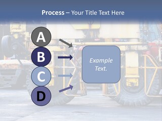 A Large Yellow Machine Is Parked In Front Of A Building PowerPoint Template