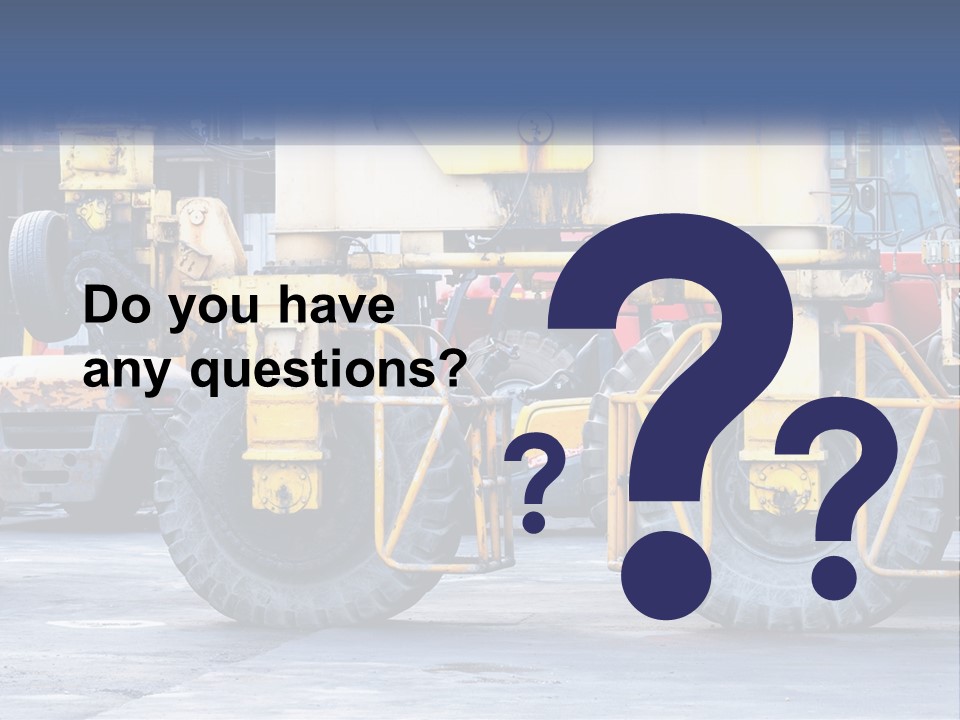 A Large Yellow Machine Is Parked In Front Of A Building PowerPoint Template
