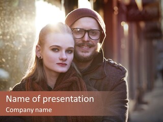 A Man And Woman Are Posing For A Picture PowerPoint Template