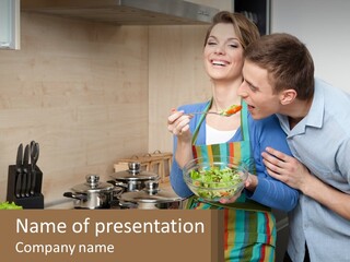 A Man And Woman Preparing Food In A Kitchen PowerPoint Template