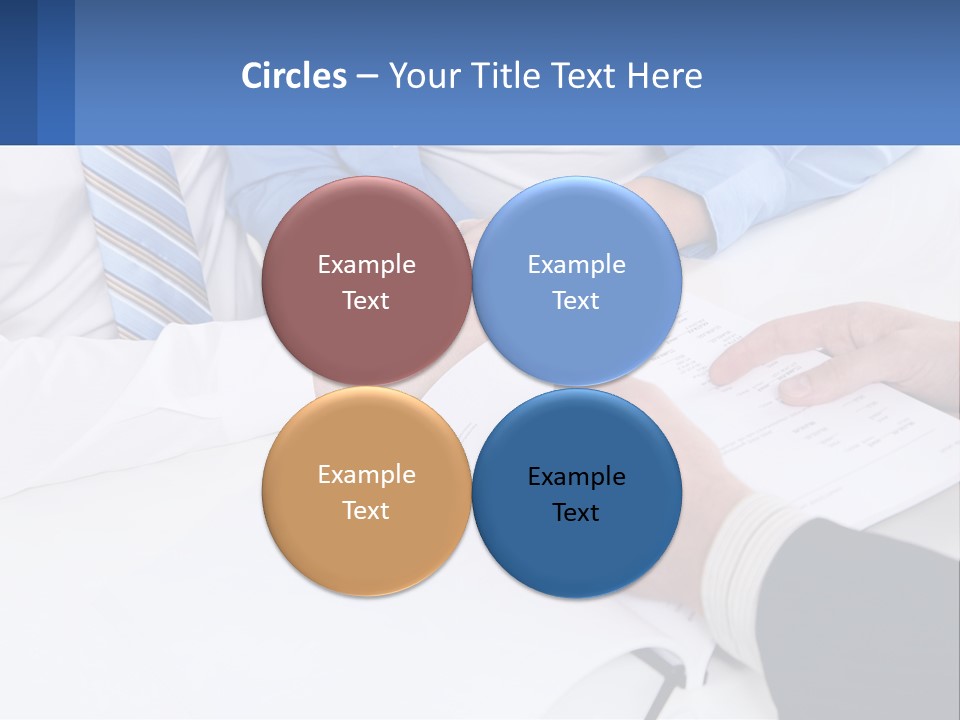 A Group Of People Sitting Around A Table With Papers PowerPoint Template