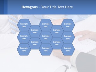 A Group Of People Sitting Around A Table With Papers PowerPoint Template