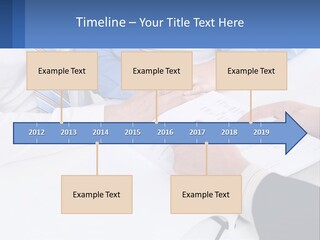 A Group Of People Sitting Around A Table With Papers PowerPoint Template