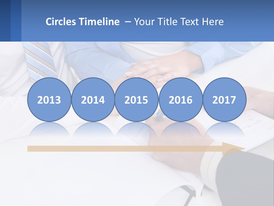 A Group Of People Sitting Around A Table With Papers PowerPoint Template