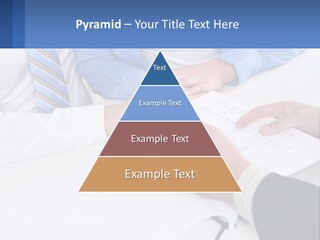 A Group Of People Sitting Around A Table With Papers PowerPoint Template