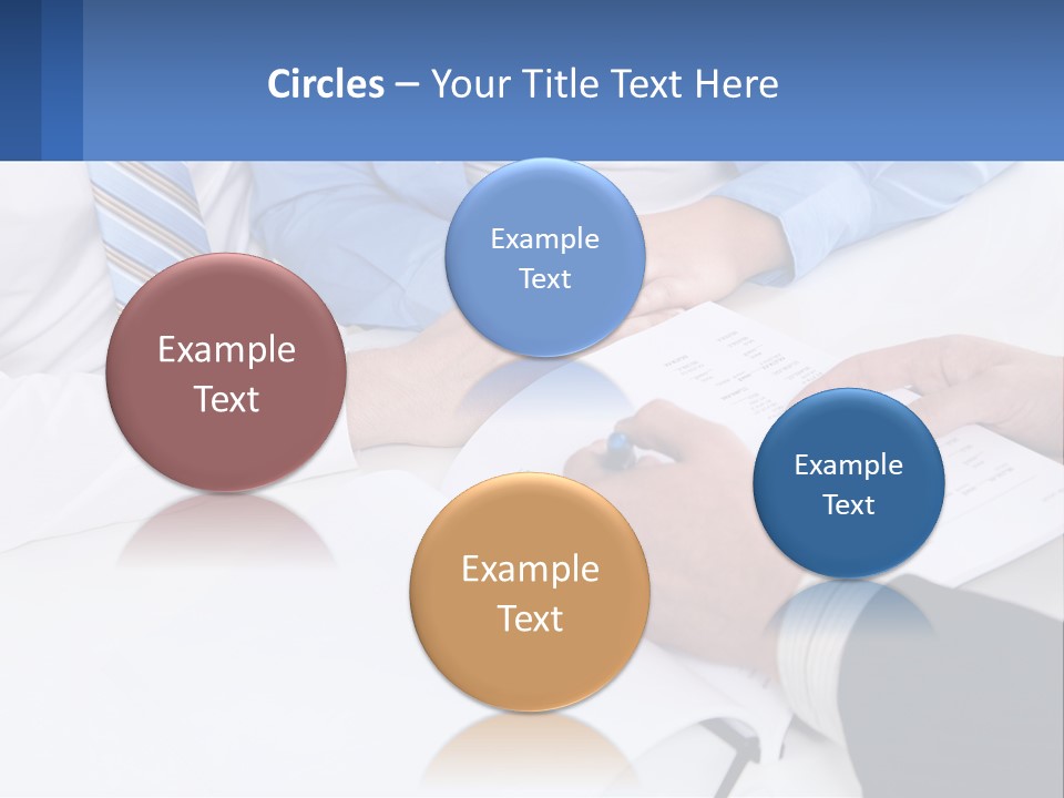 A Group Of People Sitting Around A Table With Papers PowerPoint Template