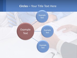 A Group Of People Sitting Around A Table With Papers PowerPoint Template