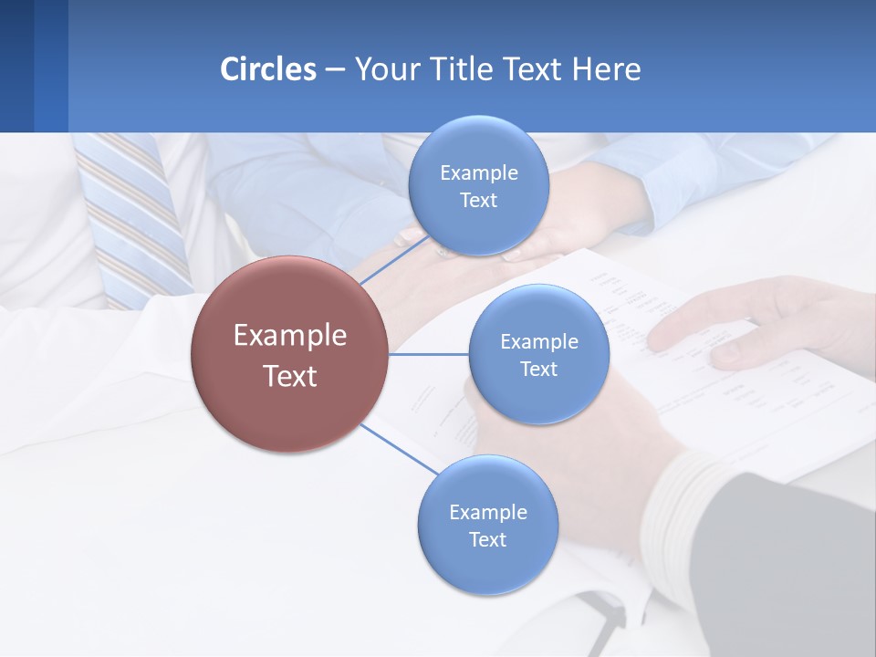 A Group Of People Sitting Around A Table With Papers PowerPoint Template