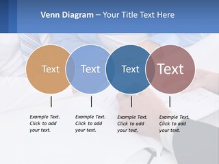 A Group Of People Sitting Around A Table With Papers PowerPoint Template