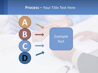 A Group Of People Sitting Around A Table With Papers PowerPoint Template