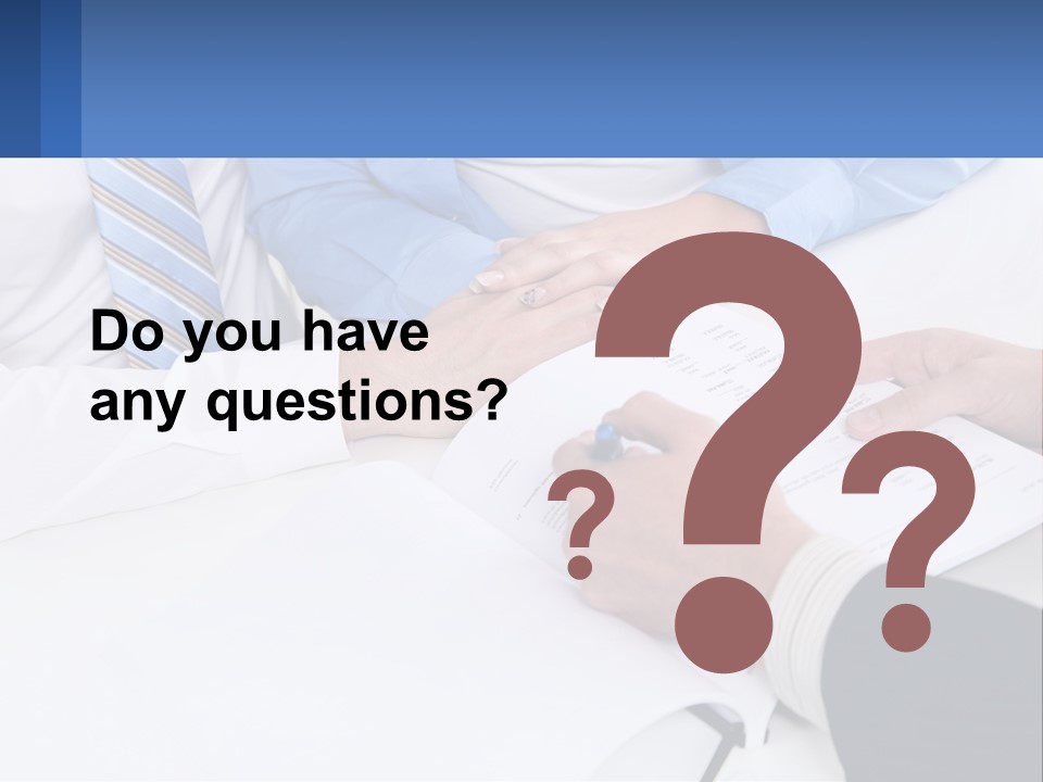 A Group Of People Sitting Around A Table With Papers PowerPoint Template