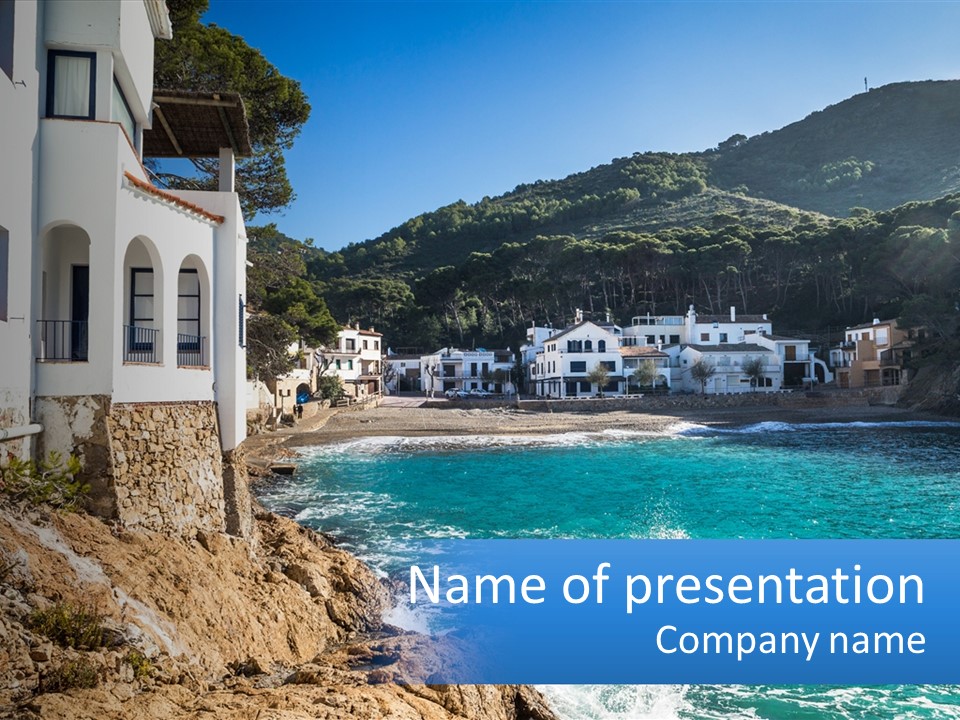 A View Of A Beach With Houses In The Background PowerPoint Template