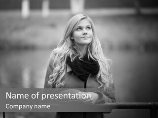 A Beautiful Blonde Woman Standing In Front Of A Body Of Water PowerPoint Template