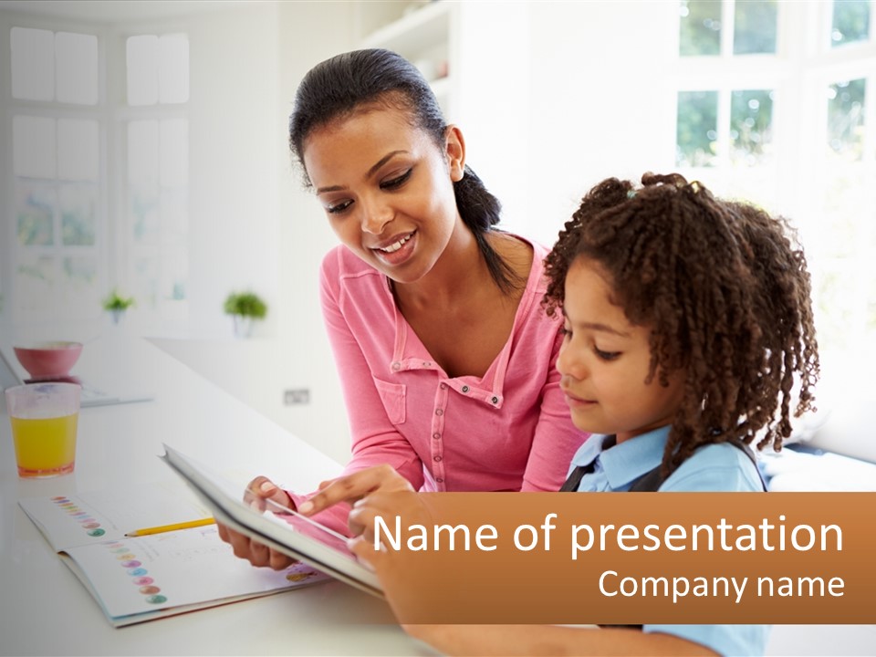 A Woman And A Child Are Looking At A Book PowerPoint Template