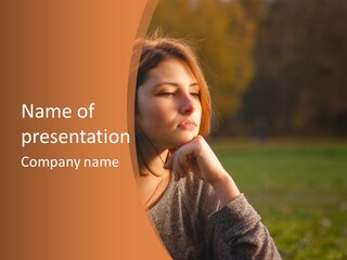 A Woman Is Sitting In The Grass With Her Eyes Closed PowerPoint Template