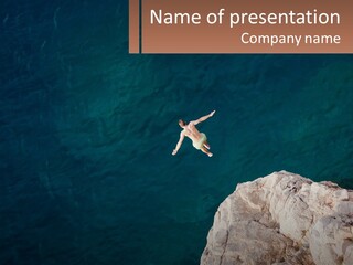 A Person Jumping Off A Cliff Into The Ocean PowerPoint Template
