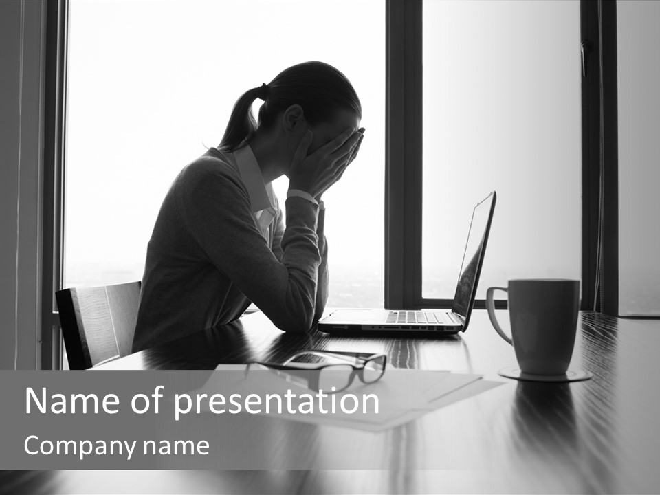 A Woman Sitting At A Desk With Her Head In Her Hands PowerPoint Template