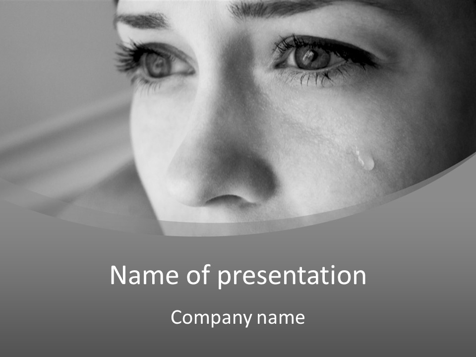 A Woman With Tears On Her Face Is Looking At The Camera PowerPoint Template