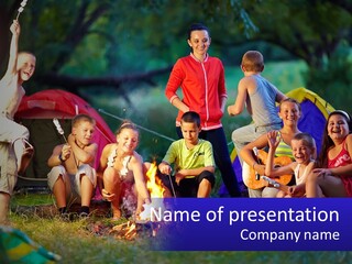 A Group Of Children Sitting Around A Campfire PowerPoint Template