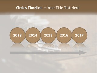 A Bunch Of Keys Sitting On Top Of A Wooden Table PowerPoint Template