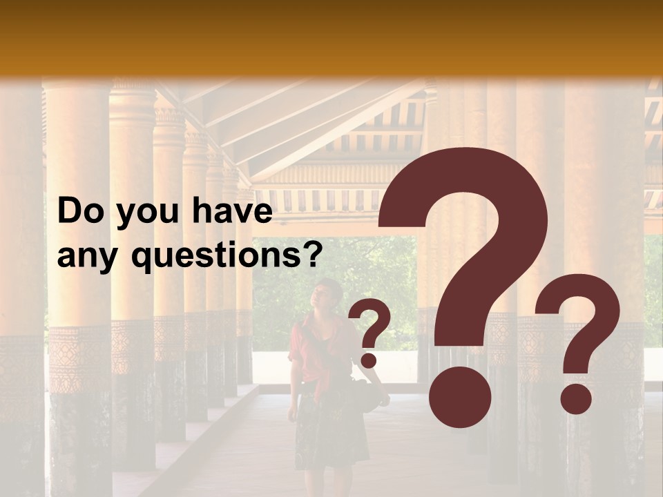 A Woman Walking Down A Walkway In A Building PowerPoint Template