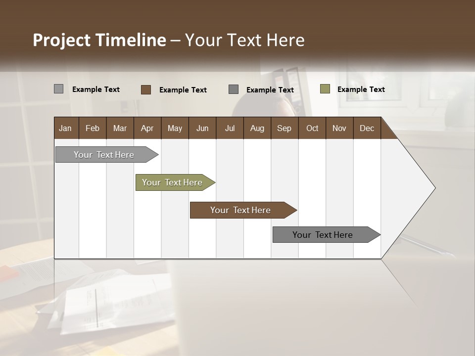 A Woman Sitting At A Desk In Front Of A Laptop Computer PowerPoint Template