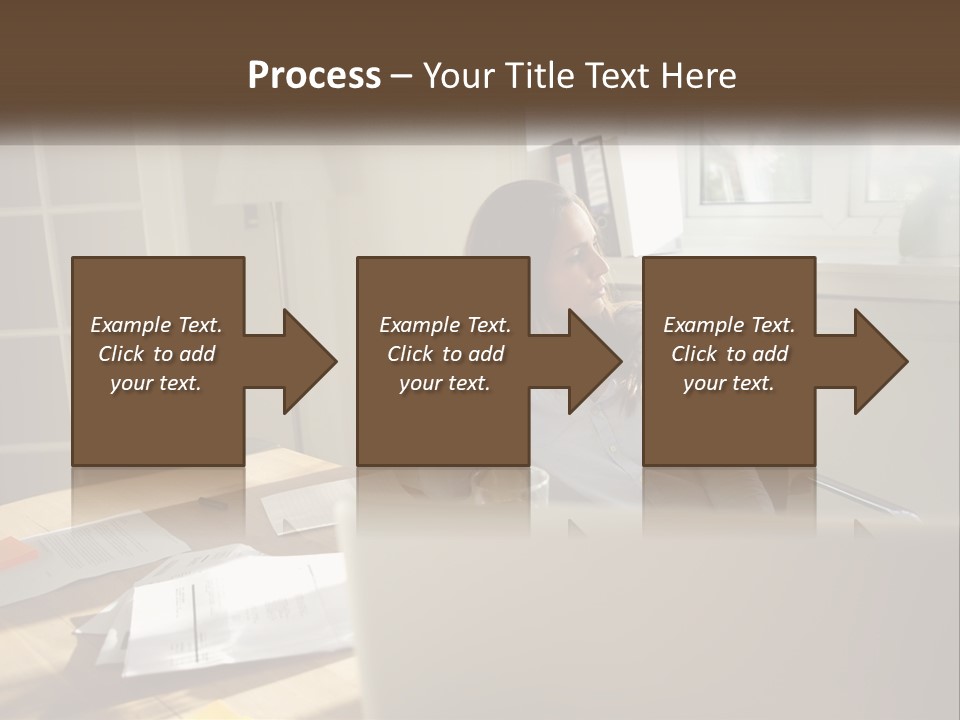 A Woman Sitting At A Desk In Front Of A Laptop Computer PowerPoint Template