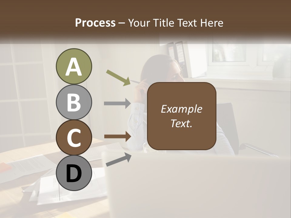 A Woman Sitting At A Desk In Front Of A Laptop Computer PowerPoint Template