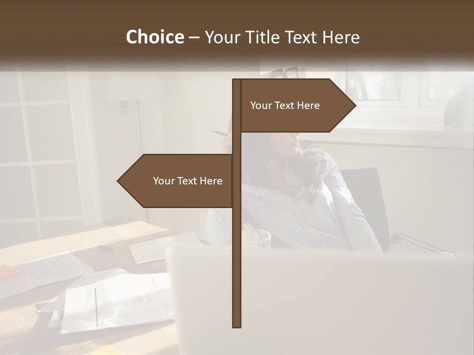 A Woman Sitting At A Desk In Front Of A Laptop Computer PowerPoint Template