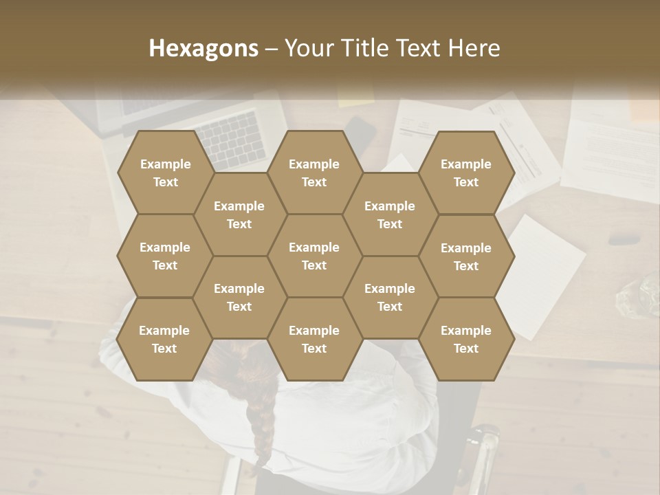 A Woman Sitting At A Table With A Laptop And Papers PowerPoint Template