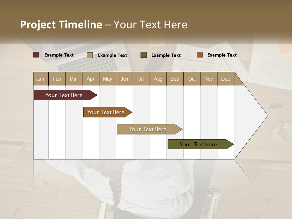 A Woman Sitting At A Table With A Laptop And Papers PowerPoint Template