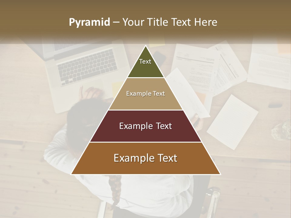 A Woman Sitting At A Table With A Laptop And Papers PowerPoint Template