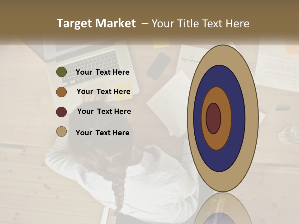 A Woman Sitting At A Table With A Laptop And Papers PowerPoint Template