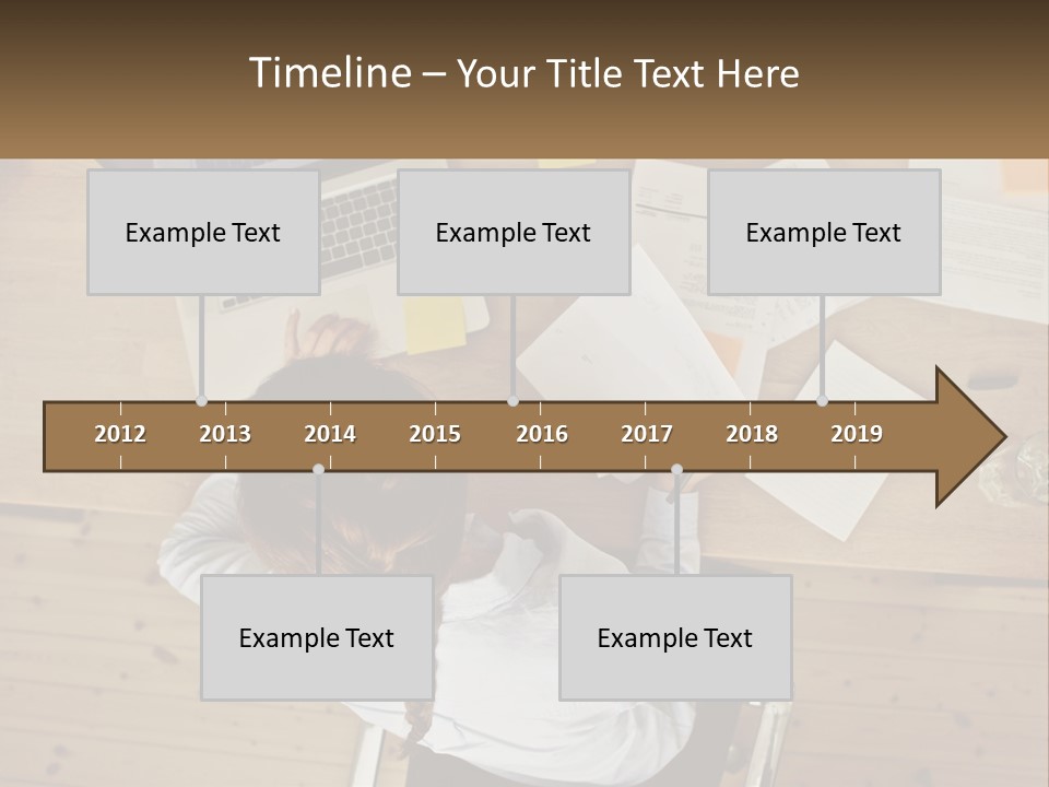 A Woman Sitting At A Desk With A Laptop And Papers PowerPoint Template
