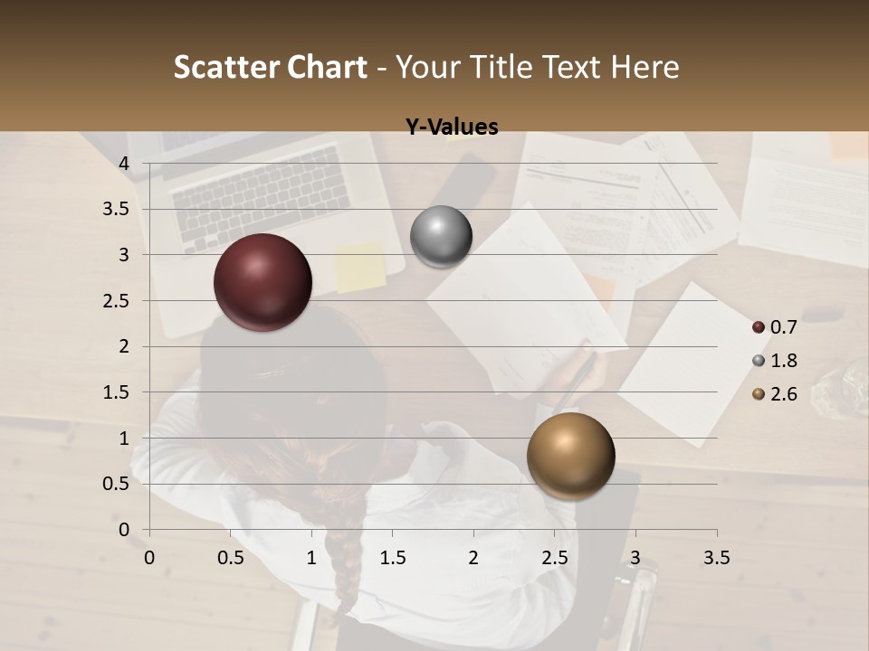 A Woman Sitting At A Desk With A Laptop And Papers PowerPoint Template