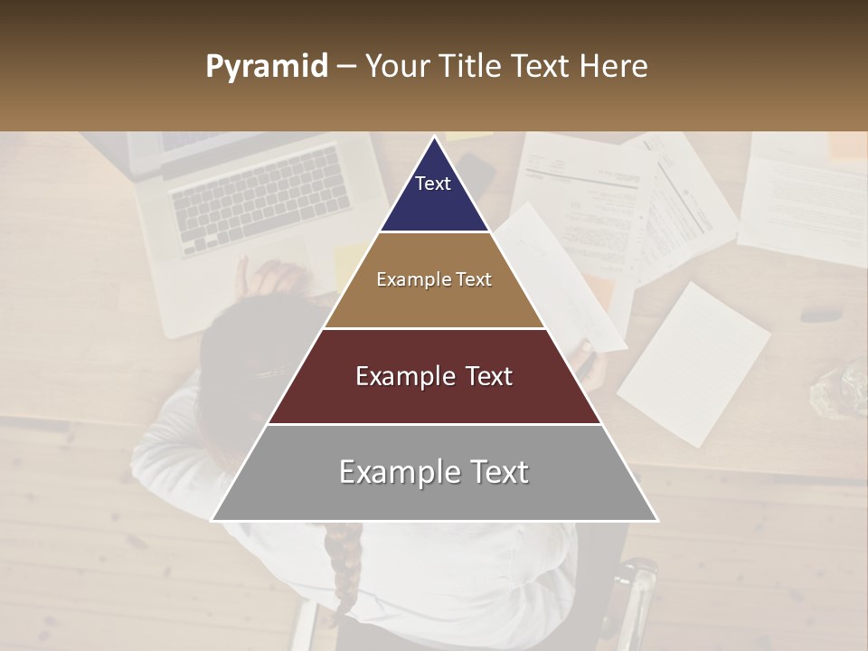 A Woman Sitting At A Desk With A Laptop And Papers PowerPoint Template