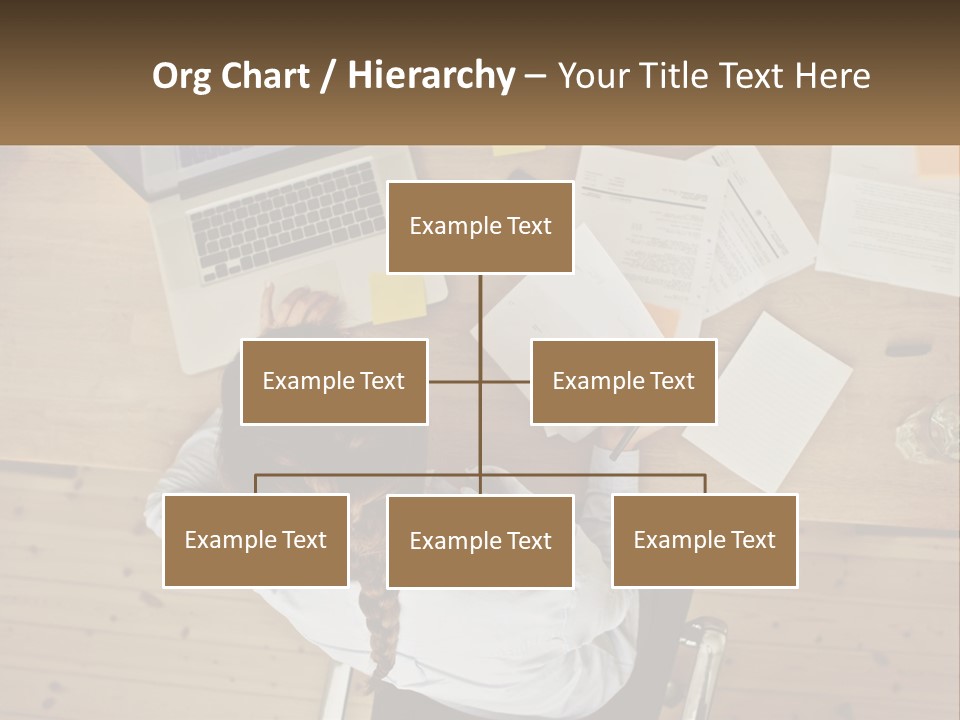A Woman Sitting At A Desk With A Laptop And Papers PowerPoint Template