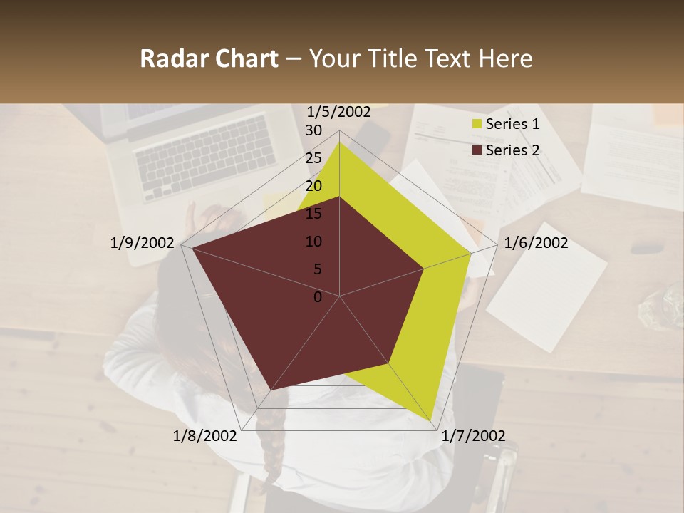 A Woman Sitting At A Desk With A Laptop And Papers PowerPoint Template