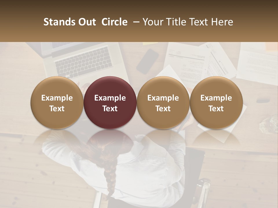 A Woman Sitting At A Desk With A Laptop And Papers PowerPoint Template