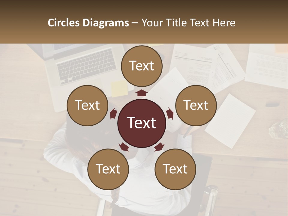 A Woman Sitting At A Desk With A Laptop And Papers PowerPoint Template