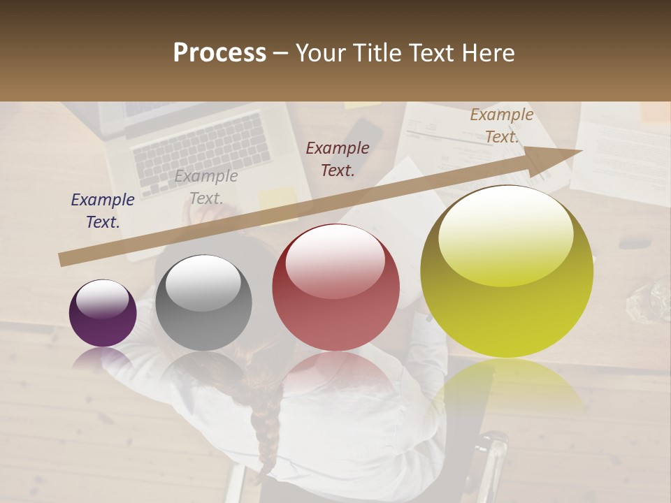 A Woman Sitting At A Desk With A Laptop And Papers PowerPoint Template