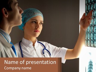 A Doctor And A Nurse Looking At A X - Ray PowerPoint Template