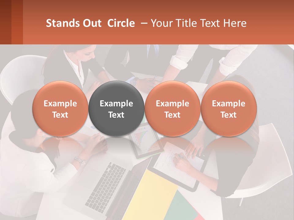 A Group Of Business People Sitting Around A Table PowerPoint Template