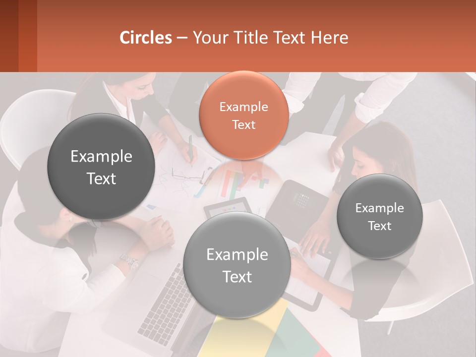 A Group Of Business People Sitting Around A Table PowerPoint Template