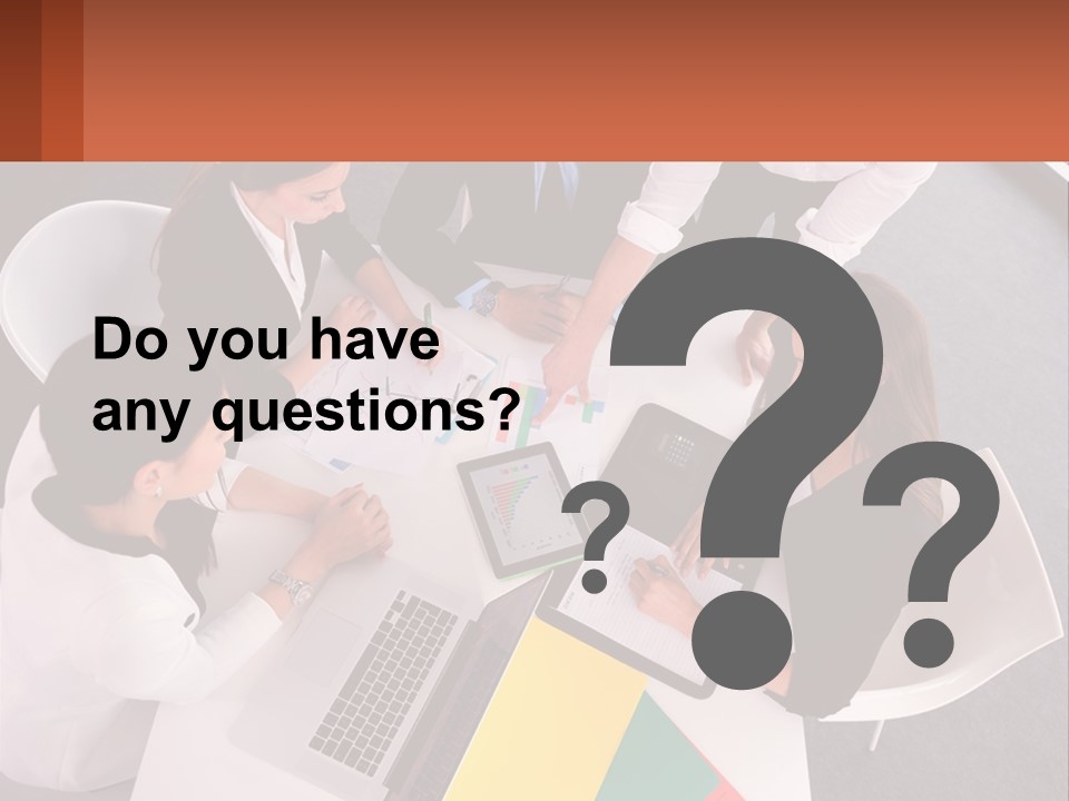 A Group Of Business People Sitting Around A Table PowerPoint Template