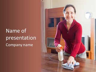 A Woman Is Cleaning A Table With A Rag PowerPoint Template