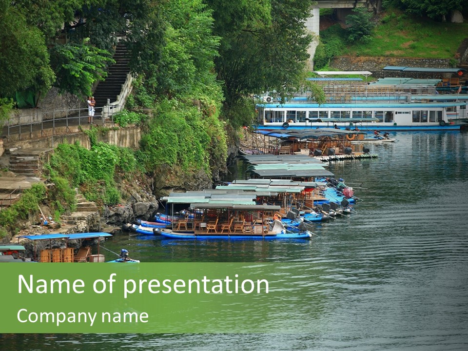 A Group Of Boats Floating On Top Of A River PowerPoint Template